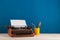 writer's workplace - red typewriter and stationery on blue blackboard background