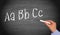 Writing ABC on chalkboard or blackboard