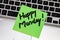 Writing on colorful sticky note Happy Monday. Text with Happy Monday on paper. Sticky note, post it on keyboard