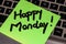 Writing on colorful sticky note Happy Monday. Text with Happy Monday on paper. Sticky note, post it on keyboard