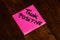 Writing on colorful sticky note Think positive. Text with Think positive on paper