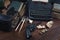 Writing a crime fiction book - old retro vintage typewriter and revolver gun with ammunitions, books, papers, old ink pen