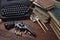 Writing a crime fiction story - old retro vintage typewriter and revolver gun with ammunitions, books, papers, old ink pen