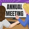 Writing displaying text Annual Meeting. Word for scheduled annually for the discussion of the business future Couple