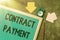 Writing displaying text Contract Payment. Business overview payments made by payer to the payee as per agreement terms