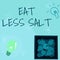 Writing displaying text Eat Less Salt. Business idea reducing the sodium intake on the food and beverages Glowing Light