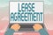Writing displaying text Lease Agreement. Business approach Contract on the terms to one party agrees rent property