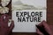 Writing Explore Nture text made in the office closeup on laptop computer keyboard. Business concept for Reserve Campsite Conservat