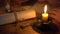 Writing letter in candlelight