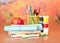 Writing materials, paints and apple