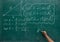 Writing the mathematics formulas on a blackboard
