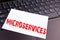 Writing Microservices text made in the office close-up on laptop computer keyboard. Business concept for Micro Services Workshop o