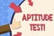 Writing note showing Aptitude Test. Business photo showcasing designed to determine a demonstrating s is ability in a