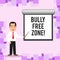 Writing note showing Bully Free Zone. Business photo showcasing creating abuse free school college life Man in Necktie
