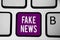 Writing note showing Fake News. Business photo showcasing Giving information to people that is not true by the media Keyboard purp