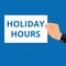 Writing note showing Holiday Hours