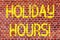 Writing note showing Holiday Hours. Business photo showcasing Celebration Time Seasonal Midnight Sales ExtraTime Opening Brick