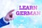 Writing note showing Learn German. Business photo showcasing get knowledge or skill in speaking and writing German language