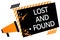 Writing note showing Lost And Found. Business photo showcasing Place where you can find forgotten things Search service Megaphone