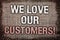 Writing note showing We Love Our Customers Call. Business photo showcasing Client deserves good service satisfaction respect Anti