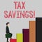 Writing note showing Tax Savings. Business photo showcasing means that you pay reduced amount of taxes than normal Man