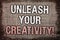 Writing note showing Unleash Your Creativity Call. Business photo showcasing Develop Personal Intelligence Wittiness Wisdom Antiq