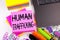 Writing showing Human Trafficking made in the office with surroundings laptop marker pen. Business concept for Slavery Crime Preve