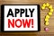 Writing text showing Apply Now. Business concept for Job Hiring Application written on tablet computer on the wooden background w