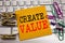 Writing text showing Create Value. Business concept for Creating Motivation written on sticky note paper on the white keyboard bac