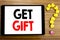 Writing text showing Get Gift. Business concept for Free Shoping Coupon written on tablet computer on the wooden background with q