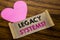Writing text showing Legacy Systems. Business concept for Upgrade SOA Application written on sticky note paper, wooden wood backgr