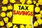 Writing text showing Tex Savings . Business concept for Tax Savings Extra Money Refund Written on sticky note paper, wooden backgr