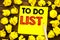 Writing text showing To Do List. Business concept for Plan Lists Remider Written on sticky note paper, wooden background with fold