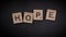 Writing the word Hope with wooden letters