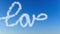 Writing word love with clouds