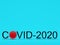 Written word Covid-2020 with a red virus instead of a letter on a turquoise background. 3D rendering.