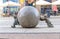 Wroclaw, Poland, May 7, 2019: two Dwarfs are pushing marble ball, famous bronze miniature gnome