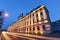 Wroclaw university with vehicular light trails, in the evening.