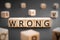 Wrong - word from wooden blocks with letters