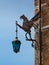 Wrought Iron Dragon with Lantern, decoration on brick wall