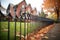 wrought iron fence around a brick tudor property