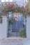 Wrought iron gate with a bougainvillea arbor at San Francisco, California