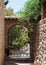 Wrought iron gate on the narrow street