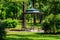 Wrought iron gazebo in park at summer