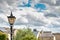 Wrought iron lamppost seen against a summer`s sky in a North Yorks market town.