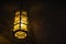 Wrought iron lantern hanging in a medieval castle vault