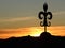 The wrought iron lily of Gubbio at sunset