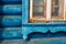 Wry wooden frame on a country house with yellow sealing foam in russian village