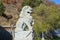 Wudalianchi, China. Sculpture of the mythological lion in front of the entrance to the monastery Zhongling on the top of extinct