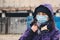 Wuhan coronavirus and epidemic virus symptoms. Person in mask protection against the flu in street. New coronavirus 2019-nCoV from